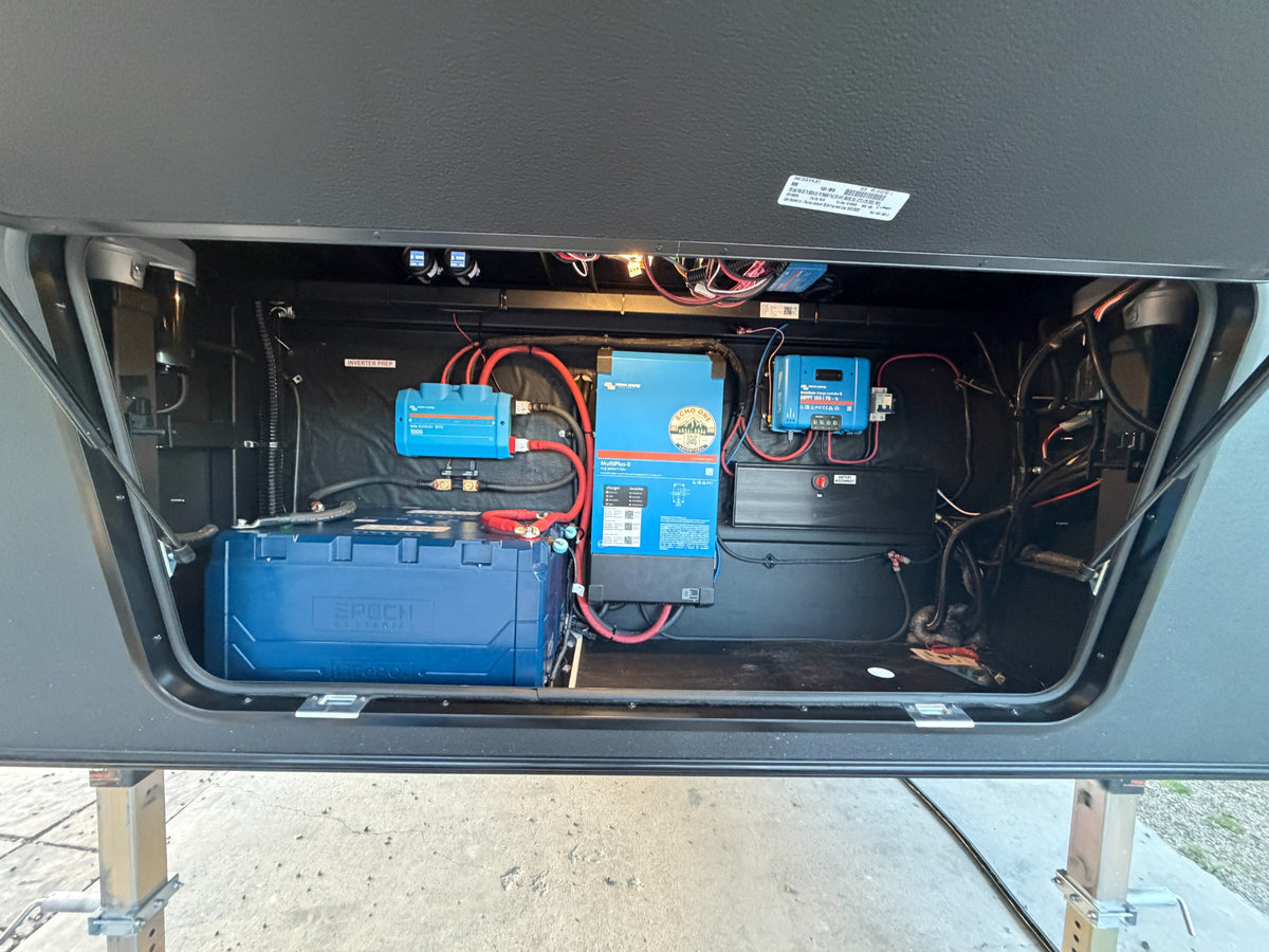Epoch battery, Victron inverter and solar charge controller installed together in an RV compartment