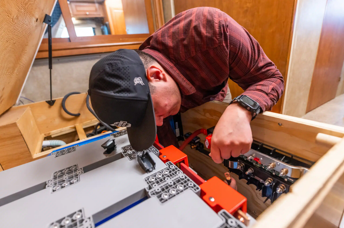 Technician working on an RV electrical installation